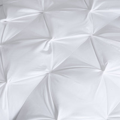 Set of pinch pleat European pillows styled on a bed in a New Zealand home

