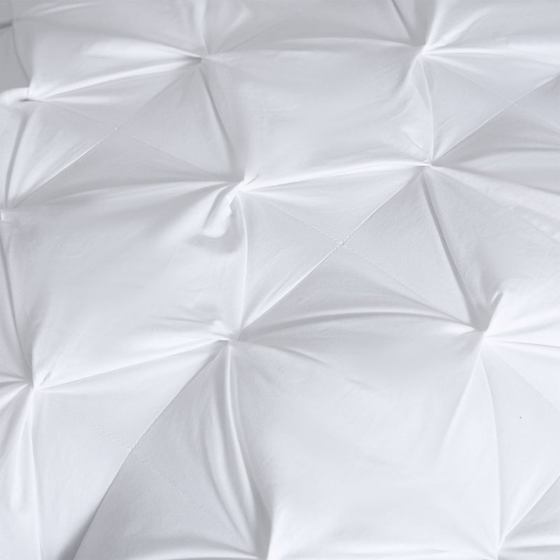 Set of pinch pleat European pillows styled on a bed in a New Zealand home

