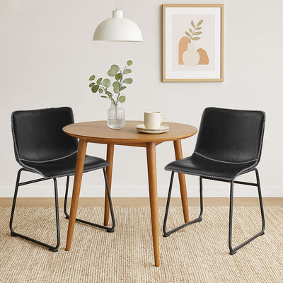 Stylish and practical Adele dining chairs in black – set of 2