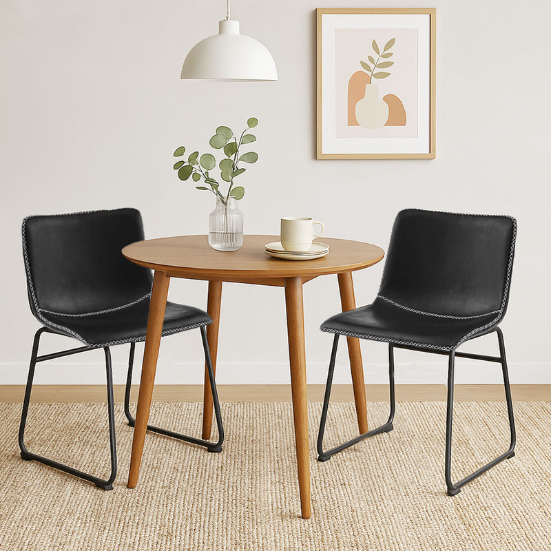 Stylish and practical Adele dining chairs in black – set of 2