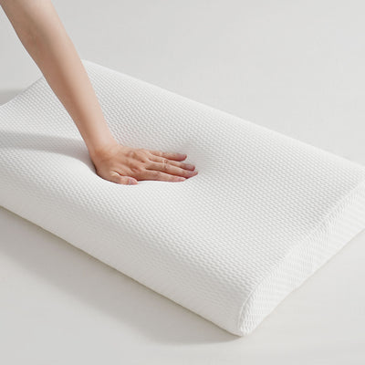 Ergonomic neck support pillow displayed on bed in New Zealand home setting

