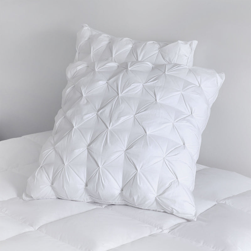 Front view of pinch pleat European pillows showcasing decorative pleat detail

