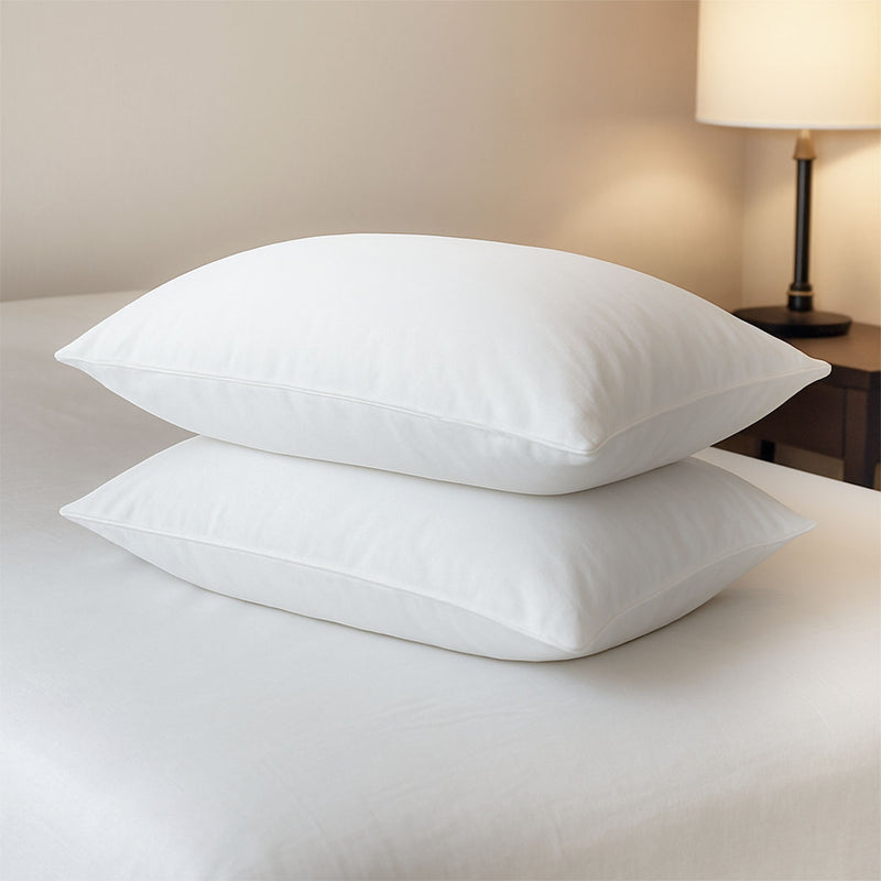 Feather down pillows laid on bed – luxurious sleep solution in NZ