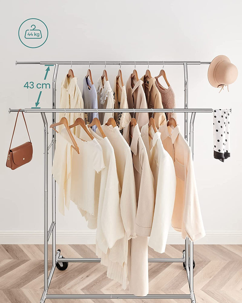 The Heavy Duty Metal Garment Rack folded down for easy storage, showing its compact design and versatility.