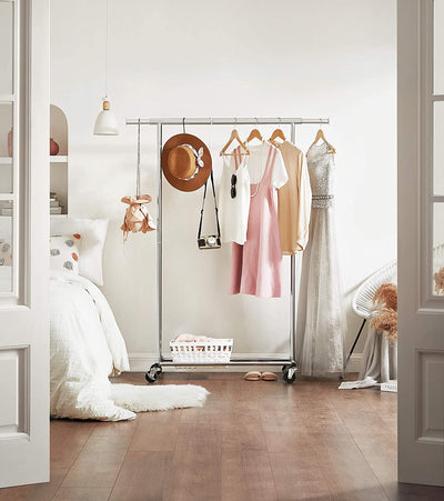 Heavy Duty Metal Garment Rack accessorized with hangers and a shoe rack