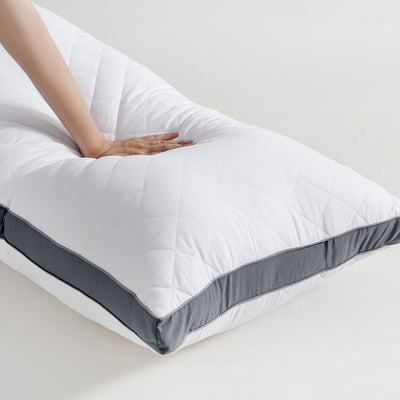 Long body pillow styled on bed in a New Zealand bedroom setting