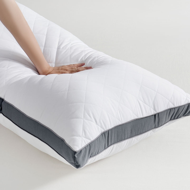Long body pillow styled on bed in a New Zealand bedroom setting