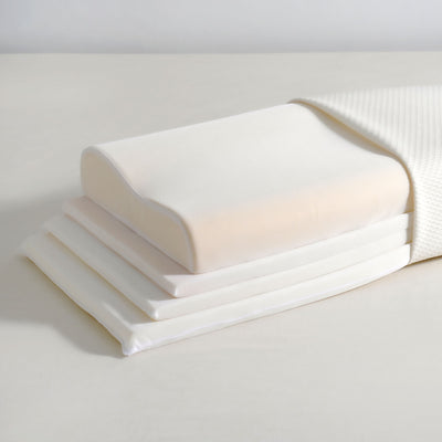 Adjustable memory foam pillow styled on a bed in a modern New Zealand bedroom
