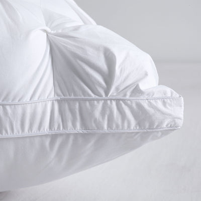 Corner detail of elegant pinch pleat European pillow with soft fabric finish


