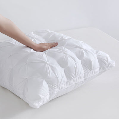 Close-up of luxurious pinch pleat texture on European-style pillow cover

