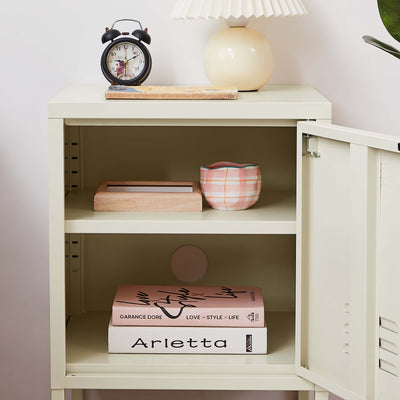 Open drawer of Rainbow Bedside Table Locker in cream, displaying storage space.