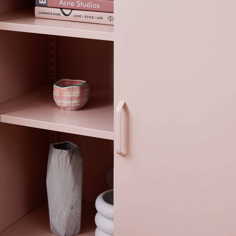 Open cabinet view of the Rainbow Sideboard Storage Locker in pink, showing the spacious shelves inside.