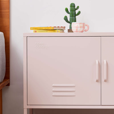 Open door of the pink Rainbow Steel Storage Locker revealing its spacious interior and shelving.