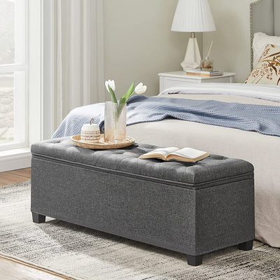 Side view of the grey Storage Ottoman Bench Seat, highlighting its length and fabric texture.