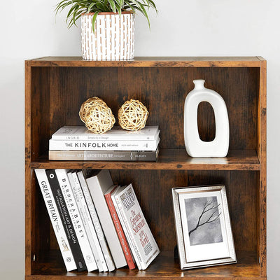 The Vasagle 6 Tier Open Bookcase in brown fully loaded with books and decorative items, illustrating its capacity and aesthetic appeal.