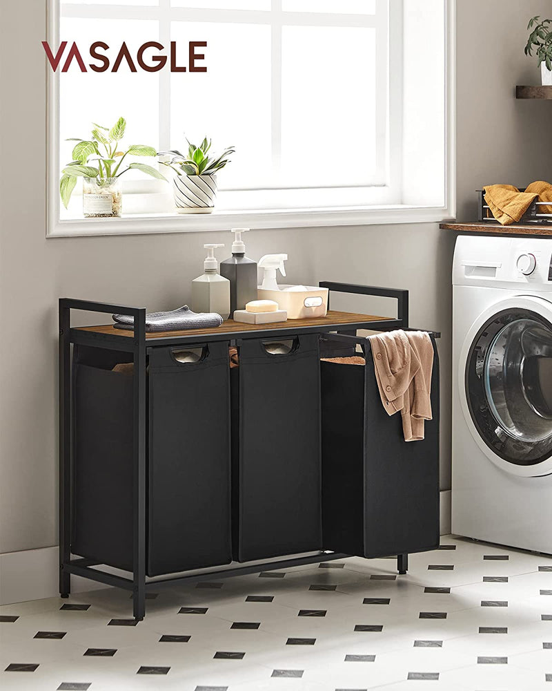 The Vasagle Laundry Hamper Basket in brown fully loaded with laundry, demonstrating its spacious capacity.